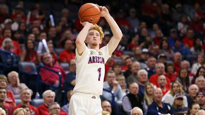 Nico Mannion shoots a three against Washington State in March.